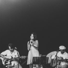 Guest performer singing with Bali Wedding Band at an intimate wedding reception on Keramas Beach, Bali